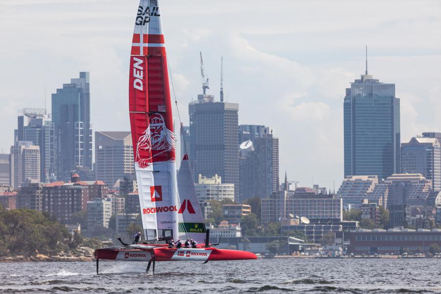 The Denmark SailGP Team cutting through the waters around Sydney