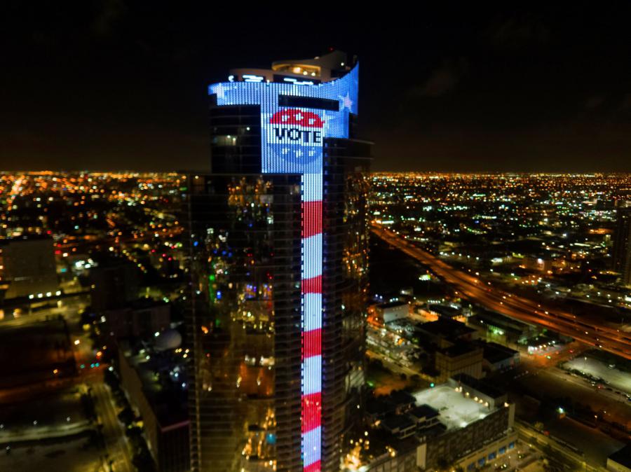 Early Voting Florida, Largest Electronic U.S. Flag & L.E.D. "VOTE" Button Image Appearing on 700-Foot, 60-Story, $600-Million Paramount Miami Worldcenter, Lighting-Up City's Skyline ( Bryan Glazer | World Satellite Television News )