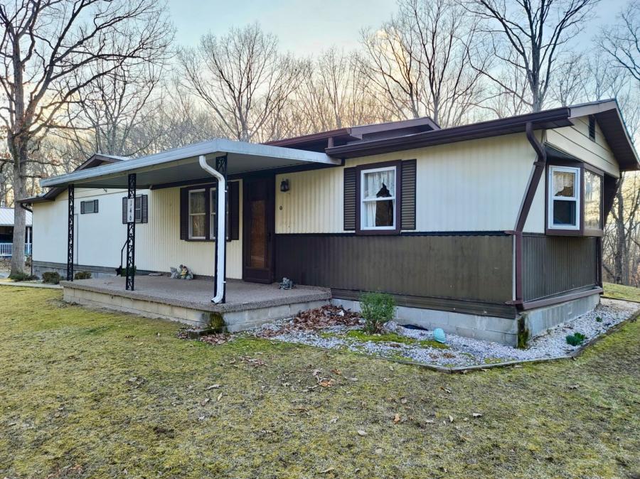 2 BR/2 BA mobile home on a permanent foundation on .77± +/- acre lot -- Walk-out basement & 2 car attached garage -- Centrally located between Romney, WV, Keyser, WV & Cumberland, MD and only 20 minutes to I-68