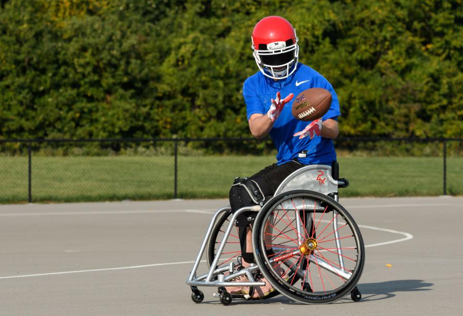 USA Wheelchair Football Player Catching the Ball