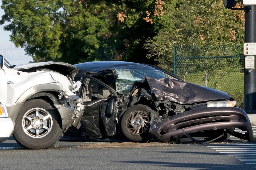 image of two cars crushed from an accident
