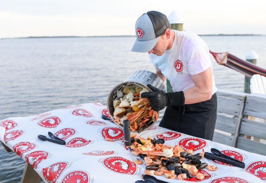 Pouring out a Signature Seafood Boil
