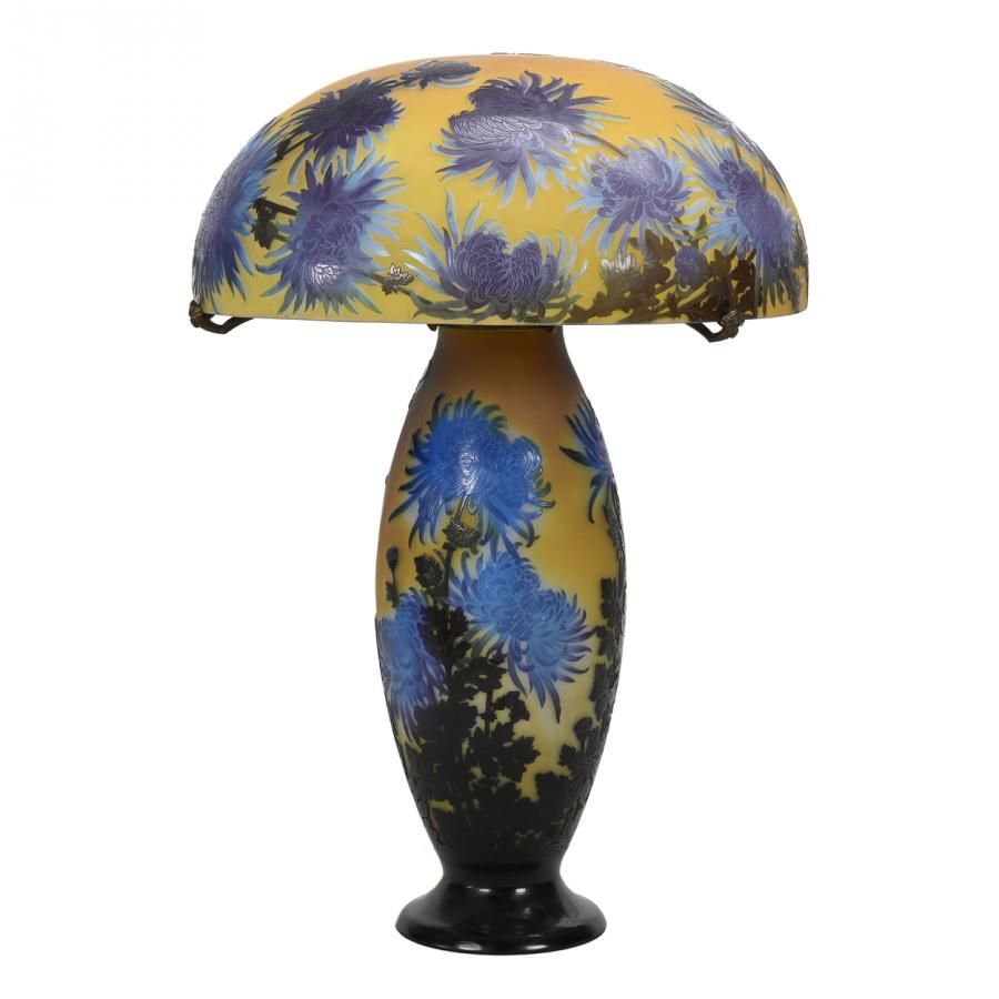 Signed Galle French cameo art glass lamp, circa 1920, 30 inches tall, with a lovely yellow ground with blue and amethyst cameo carved Japanese chrysanthemum overlay and butterfly highlights ($93,500).