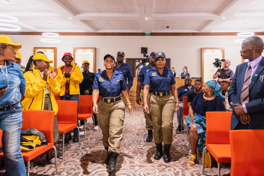 Tshwane Metro Police Officers marching to hand over the special award to the Scientology Volunteer Ministers.