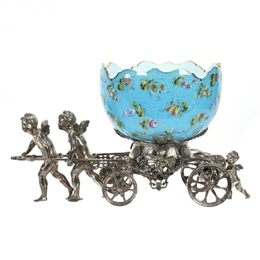 Victorian brides’ basket, featuring a blue cased art glass bowl with silver mica highlights and a colorful enamel scattered floral décor, set on an incredible Rogers Bro. #186 silverplate frame ($9,000).