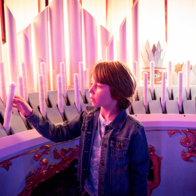 young boy interacting with Meow Wolf Denver exhibition