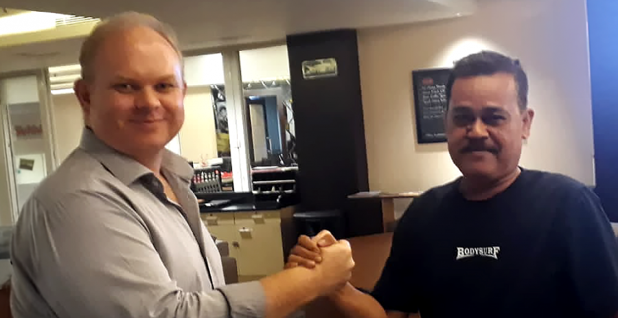 Enegra CEO, Matthew Averay, and SLI Director, Ariffudin Kadi Karib, shaking hands