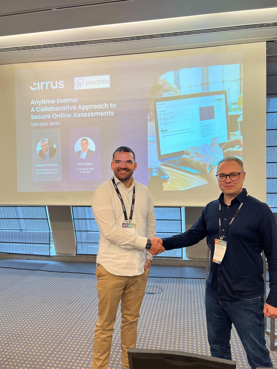 Mike Olsen, CEO, Proctorio shaking hands with Vegard Sivertsen, CEO, Cirrus Assessment at OEB Global 2023