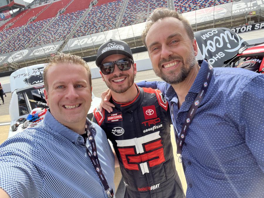 Infamous Whiskey CEO Lorenze Tremonti and President Mark Matuszek take a pit road selfie with Tanner Gray driver of the TRICON Garage #15 Toyota Tundra