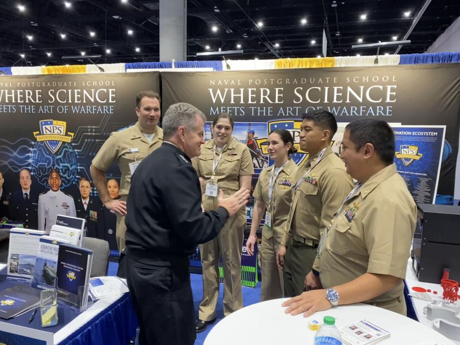 Adm. Samuel J. Paparo visits with Naval Postgraduate School students at NPS' WEST 2024 Conference booth, Feb. 15, 2024. (Photo courtesy of NPS)