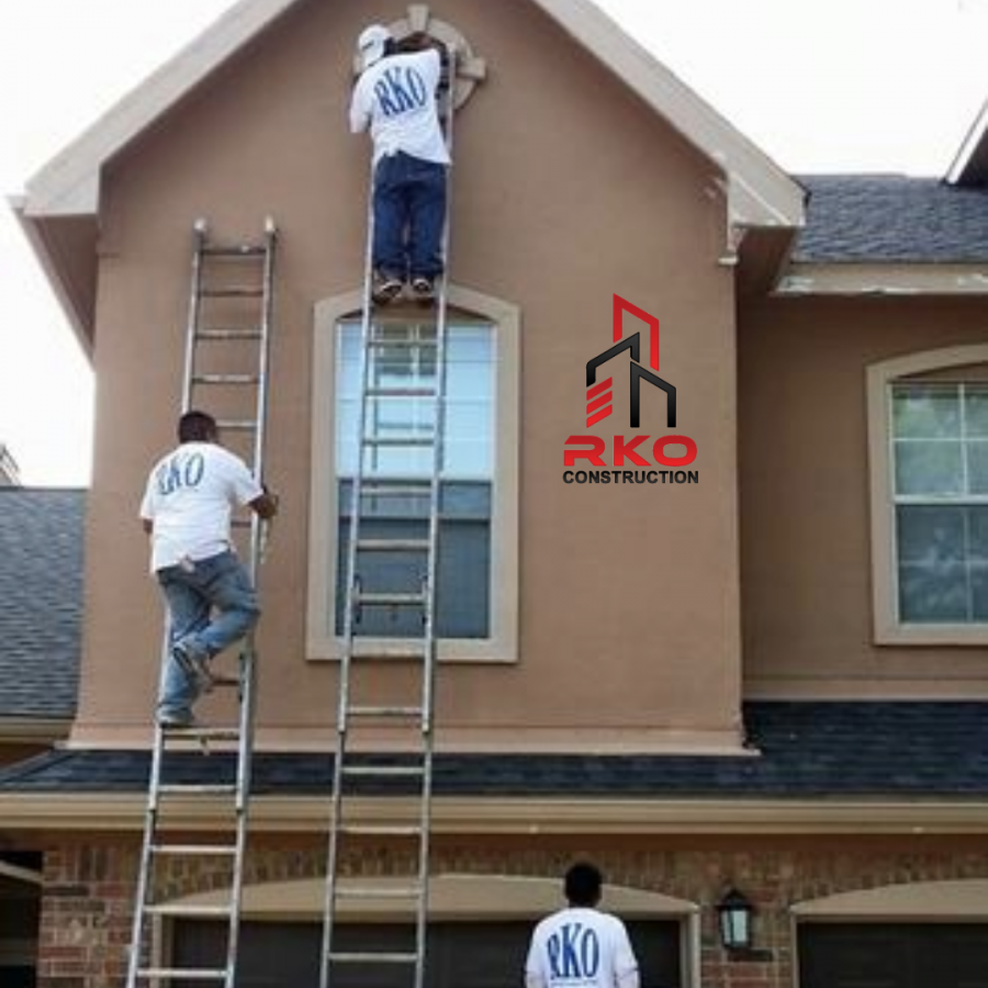 RKO Construction painting crew working on ladders refreshing exterior paint