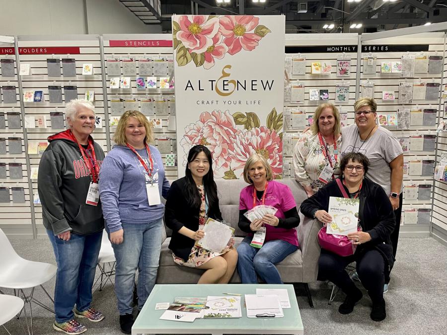 Altenew Marketing Director May Park with customers at Creativation 2023.