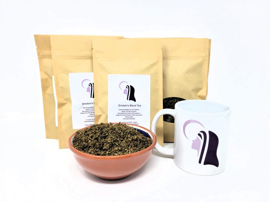 A picture of a bowl of shredded hemp flower with standing pouches behind the bowl and a mug with the Sister's logo