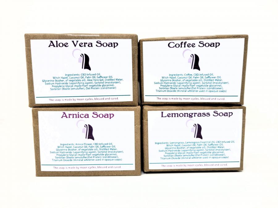 aloe vera soap, arnica soap, lemongrass soap and coffee soap, handmade, wrapped in brown paper with a simple label affixed identifying the soap and the Sisters of the Valley