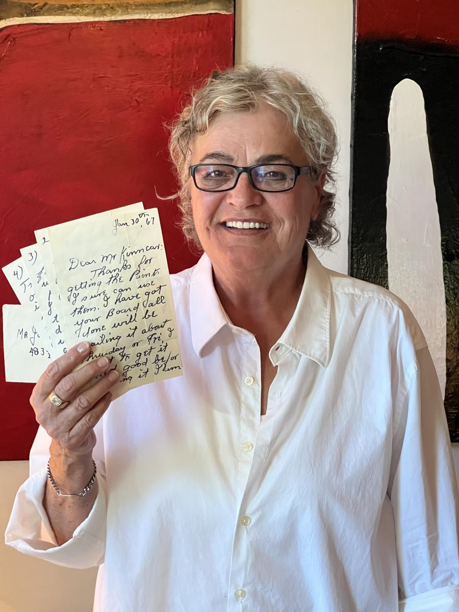 Sheila Kinnear, the daughter of the late John H. Kinnear, holds a group of letters written to her father by the acclaimed Nova Scotia artist Maud Lewis. The letters will be sold this Saturday, April 13th, by Miller & Miller Auctions Ltd.