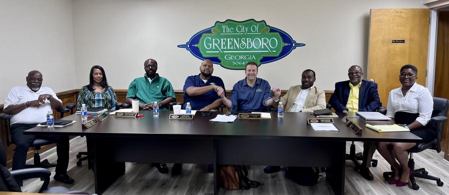 Shortly after the successful rezoning of Infamous Whiskey's downtown property, CEO Lorenze Tremonti and the Greensboro, Georgia City Council commemorate the moment with a photo.