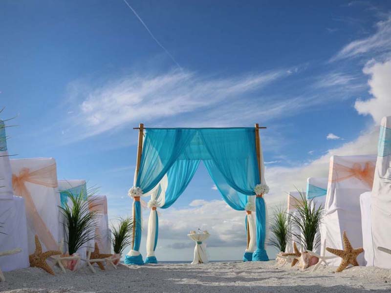 Affordable Florida beach wedding and reception packages with a new reception menu and Florida beach wedding arch