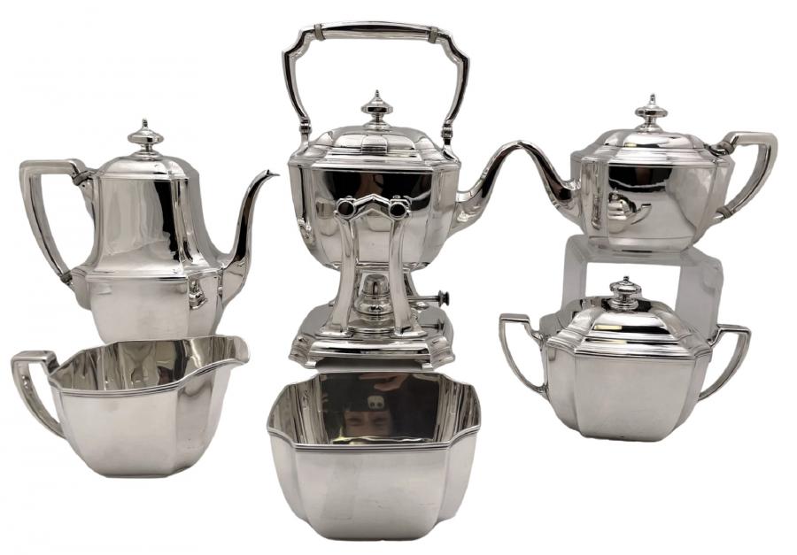 Tiffany & Co. sterling silver tea and coffee service in the Hampton pattern number 18389 from 1912 in the Art Deco style, with an elegant, geometric design, weighing 126.8 troy oz. (est. $6,900-$9,500).