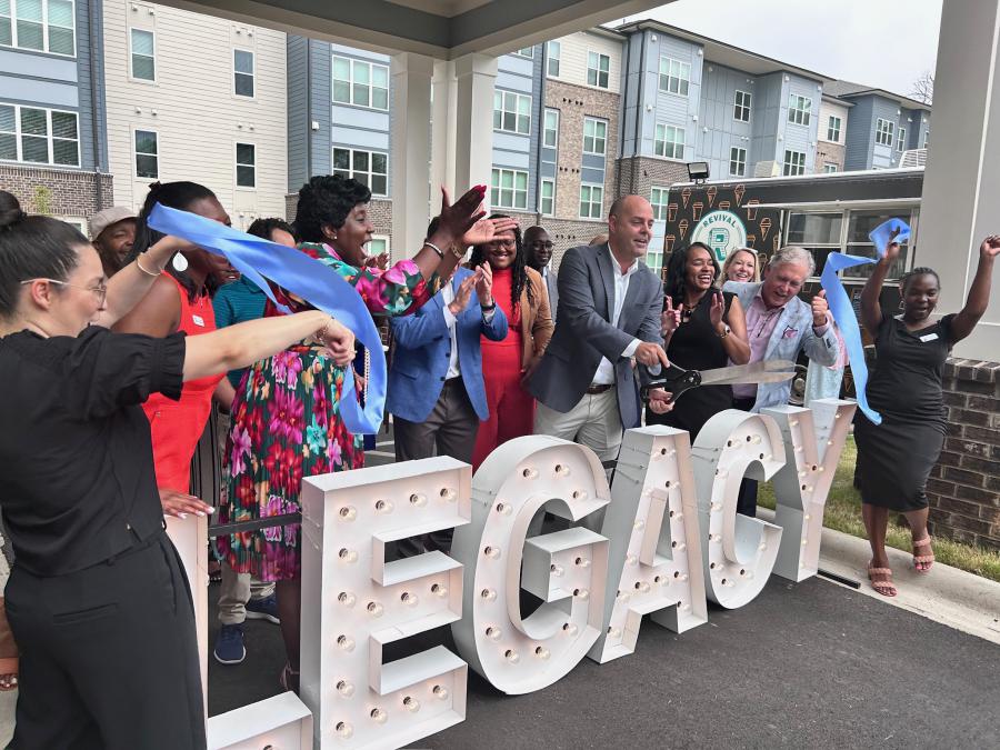 Steven Bauhan of The Paces Foundation cuts the ribbon at the Grand Opening of Legacy at Carr Heights in Charlotte, NC