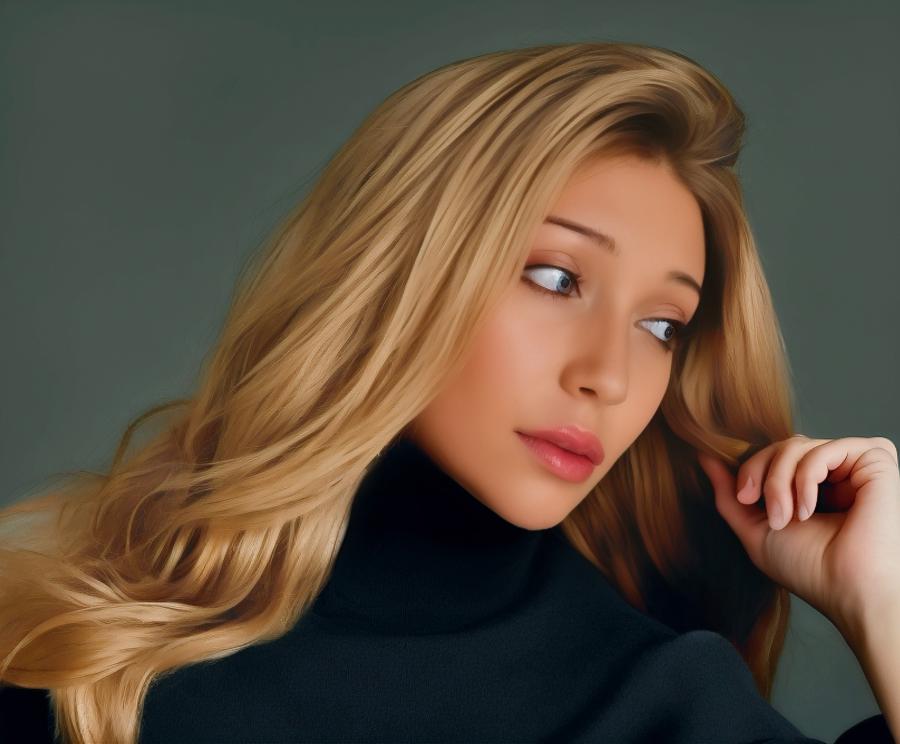 Songwriter and Music Producer Zoey Tess is pictured with long medium blonde hair, wearing a black turtle neck sweater and has a serious, outward expression.