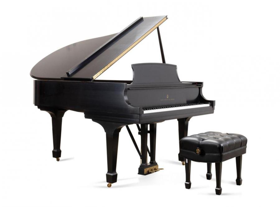 1997 Steinway ebony Model M baby grand piano showing the maker’s mark and the serial number to a metal plate, accompanied by a Jansen black diamond tufted artist bench (est. $12,000-$18,000).