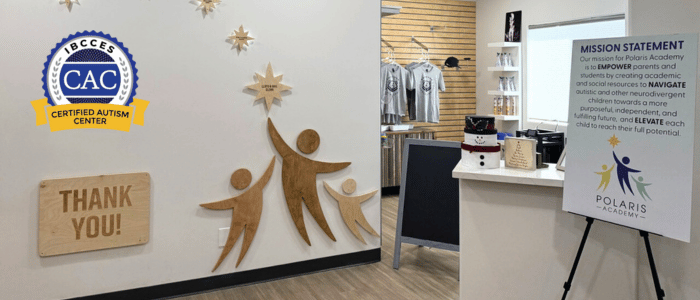 Welcoming interior of Polaris Academy with "Thank You!" sign, autism certification badge, and mission statement displayed prominently.