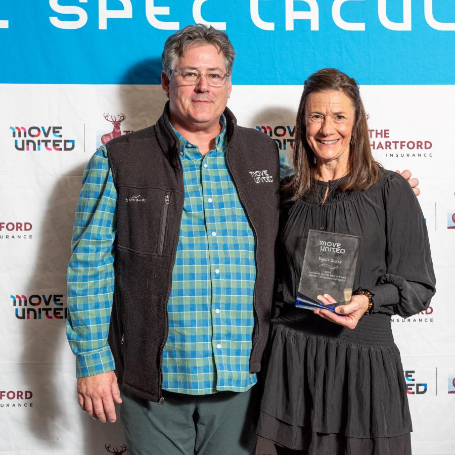 Glenn Merry and Sandy Dukat holding an award