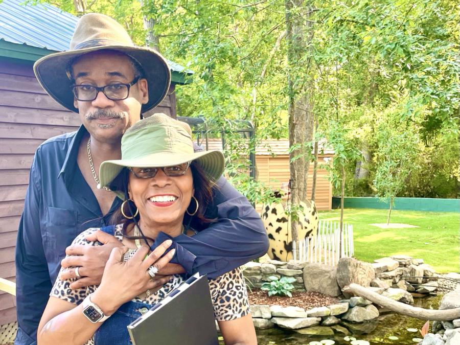 Sweet Valley Ranch owners Fred and Anita Surgeon enjoy a quiet moment outside one of the guest cabins, just steps from the koi ponds.