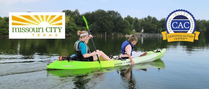 Two women paddle a bright green kayak on a peaceful lake, surrounded by lush greenery, with logos for Missouri City and Certified Autism Center.