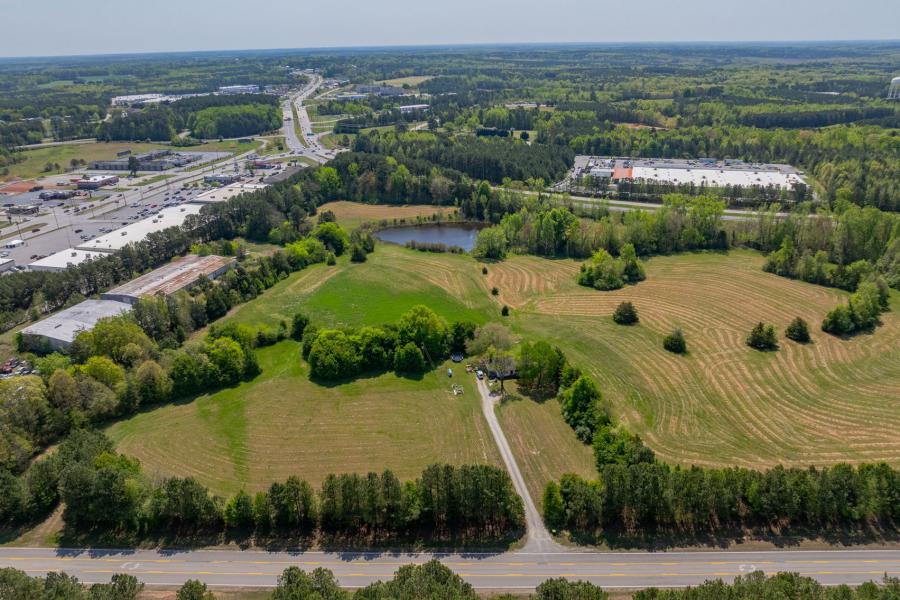 26.2 +/- acres of prime commercial land in South Hill, VA. Frontage on Maple Lane, Rt. 58 Bypass and minutes from I-85. This property has utilities & a recent Phase 1 environmental study. There is a 3 BR/1.5 BA 2,400 +/- sf. home on the property. 