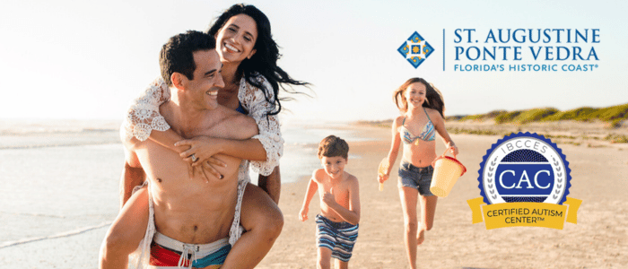 A family enjoys a sunny day at the beach, playing in the sand and splashing in the water, with vibrant coastal scenery.