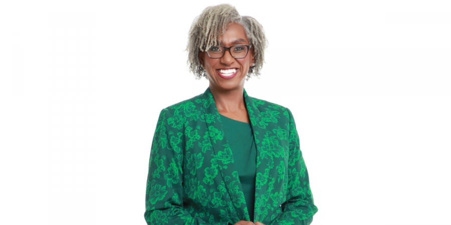 Jennifer L. Smith, CEO of Growth Potential Consulting, smiling confidently in a green floral blazer against a white background.