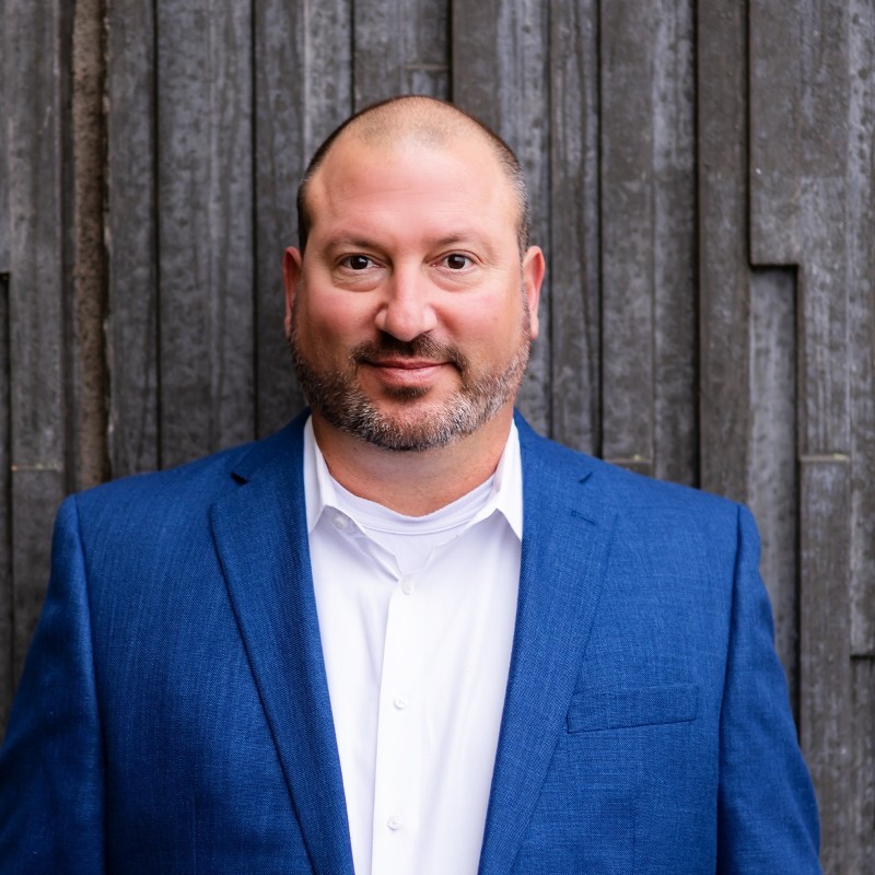 Relay Resources, the Pacific Northwest’s leading social enterprise nonprofit devoted to advancing disability inclusion in the workplace, has named Tannon Scoggins the organization’s new Vice President of Building Solutions, joining Relay’s executive leadership team Tannon Scoggins is a white male, with salt and pepper hair and beard, wearing a blue blazer and white dress shirt