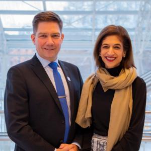 Thomas Blomqvist, Finland's Minister for Nordic Cooperation and Equality & Equality Now's Yasmeen Hassan, standing next to each other, smiling, looking to camera