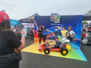 Photo of a temporary worker at a car show.