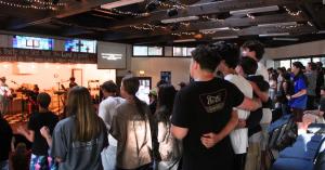 Students worship during a chapel service inside Mt. Gilead Bible Camp and Conference Center in Sebastopol, California.