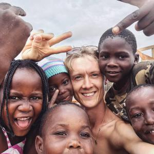 Skipper surrounded by happy children during his time in Mozambique where he helped to build a skatepark.