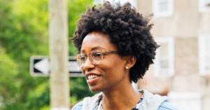 Creative Repute's CEO and Founder, Nile Livingston; a portrait of a community member engaged in conversation representing intergenerational dialogue and community engagement.