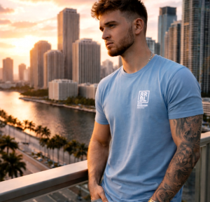 Carson Rickard, a young entrepreneur, is using one of the most challenging seasons of his life to reflect, grow, and inspire others through faith, accountability, and personal transformation Young man overlooking city skyline at sunset, reflecting during a season of personal growth and change