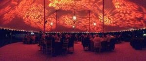 pole tent rental, decorated with light patterns