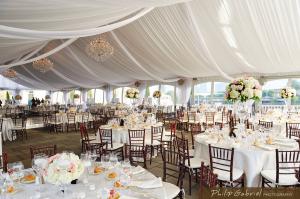 Frame tent rental, decorated with draping white fabrics