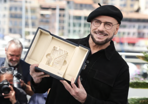 John Travolta’s Cannes look goes viral during honorary Palme d’Or moment