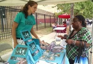 Thalia Ghiglia, DFW DC Coordinator, sharing drug prevention materials at a 2019 “Beat the Streets” event.