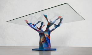 A view of painter Chris Trueman's interpretation of Edenic Design's Teâshí Coffee Table. His layering technique uses spray cans, brushes and squeegees to create a piece that is immersive whether seen from afar or close, with details that resemble nebulas in space.
