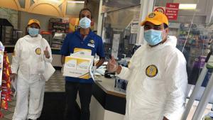 Convenience store owner receives Stay Well booklets