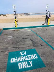 Parking spots with SemaConnect charging stations at Harbor Cove Beach are labeled EV Charging Only