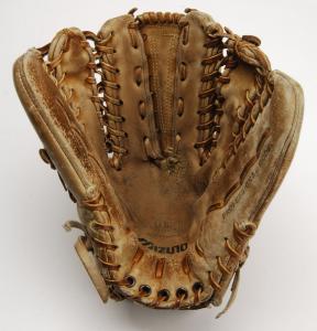 The six-finger glove that Greg A. Harris custom-designed with Mizuno Corporation, a Japanese company founded in 1906 who first marketed baseball gloves.