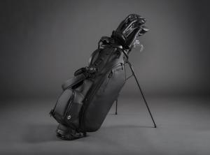 The VESSEL Player III stand bag is shown in the black colorway. It is paired with matching all-black golf head covers.