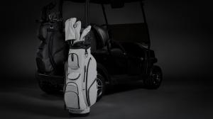 New VESSEL Lux XV Golf Cart Bags shown in all-black and all-white. Each bag is fitted with matching golf head covers.