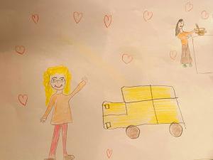 The children presented the Volunteer Ministers drawings of their bright yellow van and, in the upper right corner, one of the Warm Heart Association staff members cooking the food just delivered.